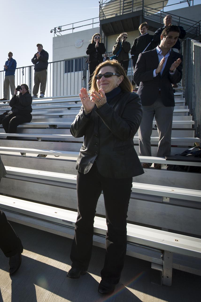 NASA Deputy Administrator Lori Garver and other guests react after having watched the successful launch of the Orbital Sciences Corporation Antares rocket from the Mid-Atlantic Regional Spaceport (MARS) at the NASA Wallops Flight Facility in Virginia, Sunday, April 21, 2013. The test launch marked the first flight of Antares and the first rocket launch from Pad-0A. The Antares rocket delivered the equivalent mass of a spacecraft, a so-called mass simulated payload, into Earth's orbit. Photo Credit: (NASA/Bill Ingalls)