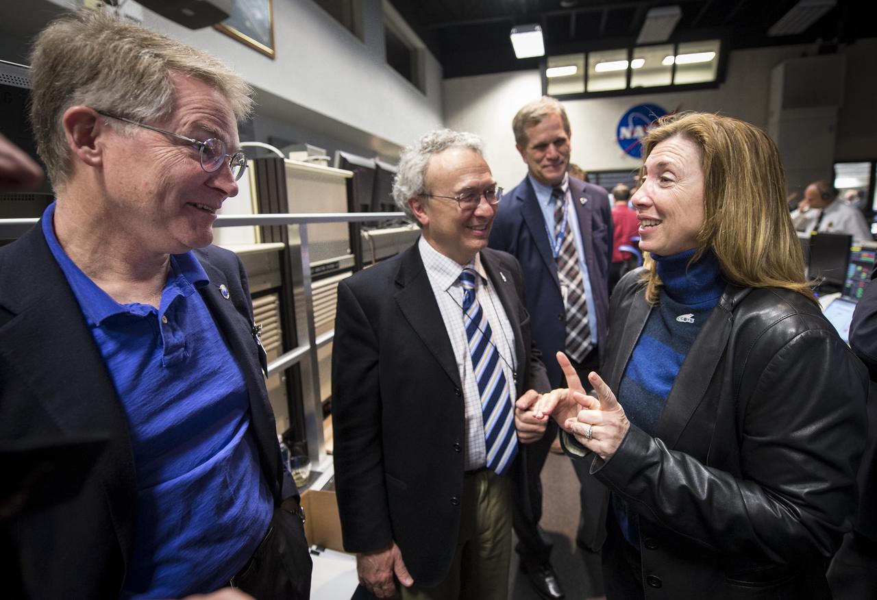 NASA Deputy Administrator Lori Garver talks with CEO and President of Orbital Sciences Corporation David Thompson, left, Executive Vice President and Chief Technical Officer, Orbital Sciences Corporation Antonio Elias, second from left, and Executive Director, Va. Commercial Space Flight Authority Dale Nash, background, in the Range Control Center at the NASA Wallops Flight Facility after the successful launch of the Orbital Sciences Antares rocket from the Mid-Atlantic Regional Spaceport (MARS) in Virginia, Sunday, April 21, 2013. The test launch marked the first flight of Antares and the first rocket launch from Pad-0A. The Antares rocket delivered the equivalent mass of a spacecraft, a so-called mass simulated payload, into Earth's orbit. Photo Credit: (NASA/Bill Ingalls)