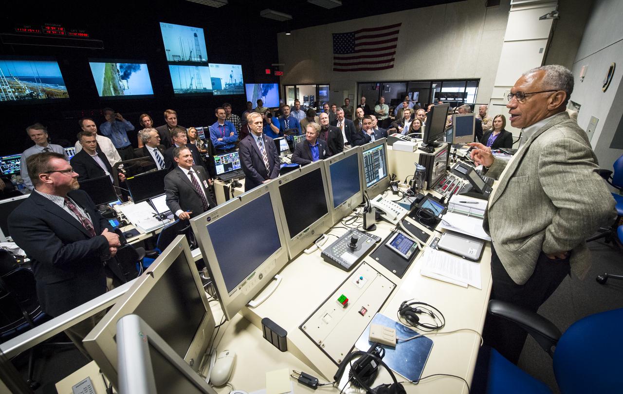 NASA Administrator Charles Bolden congratulates the Orbital Sciences Corporation launch team and management in the Range Control Center at the NASA Wallops Flight Facility after the successful launch of the Orbital Sciences Antares rocket from the Mid-Atlantic Regional Spaceport (MARS) in Virginia, Sunday, April 21, 2013. The test launch marked the first flight of Antares and the first rocket launch from Pad-0A. The Antares rocket delivered the equivalent mass of a spacecraft, a so-called mass simulated payload, into Earth's orbit. Photo Credit: (NASA/Bill Ingalls)