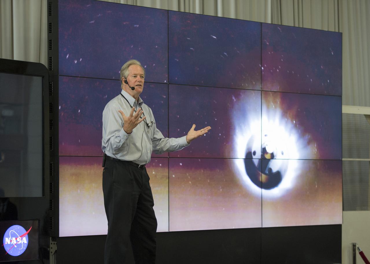 Michael Meyer, lead scientist for NASA's Mars Exploration Program at NASA Headquarters speaks in front of the Hyperwall at a NASA-sponsored Earth Day event at Union Station, Monday April 22, 2013 in Washington.  Photo Credit:  (NASA/Carla Cioffi)
