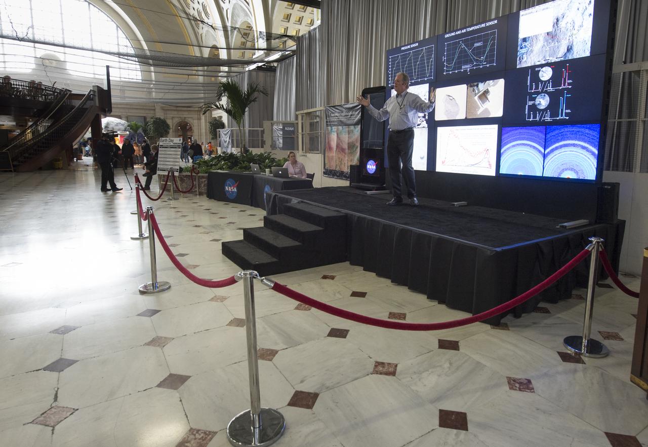 Michael Meyer, lead scientist for NASA's Mars Exploration Program at NASA Headquarters speaks in front of the Hyperwall at a NASA-sponsored Earth Day event at Union Station, Monday April 22, 2013 in Washington.  Photo Credit:  (NASA/Carla Cioffi)