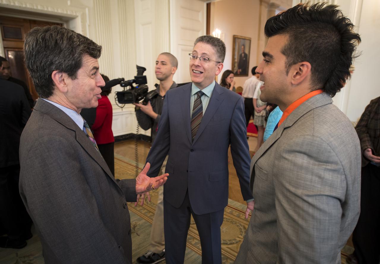 Director of Strategic Communications and Senior Science and Technology Policy Analyst, Office of Science and Technology Policy, Executive Office of the President, Rick Weiss, left, “Big Bang Theory” co-creator Bill Prady, center, and NASA Mars Curiosity Landing mission controller, Bobak "Mohawk Guy" Ferdowsi talk during the White House Science Fair held at the White House, April 22, 2013. The science fair celebrated student winners of a broad range of science, technology, engineering and math (STEM) competitions from across the country.  Photo Credit: (NASA/Bill Ingalls)
