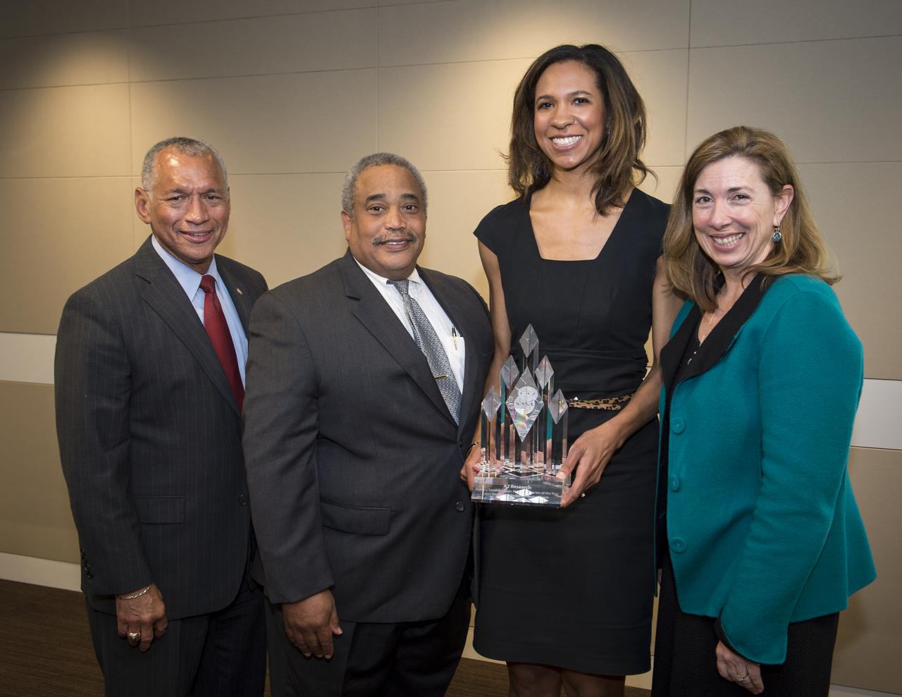 NASA Administrator Charles Bolden, left, NASA Associate Administrator for Small Business Programs Glenn A. Delgado, and NASA Deputy Administrator Lori Garver, right, pose for a photograph with Autumn Sellars, President/CEO of A2Research of Huntsville, Alabama after the company was awarded the Small Business Prime Contractor of the Year at NASA Headquarters, Tuesday, April 23, 2013 in Washington.  Photo Credit: (NASA/Bill Ingalls)