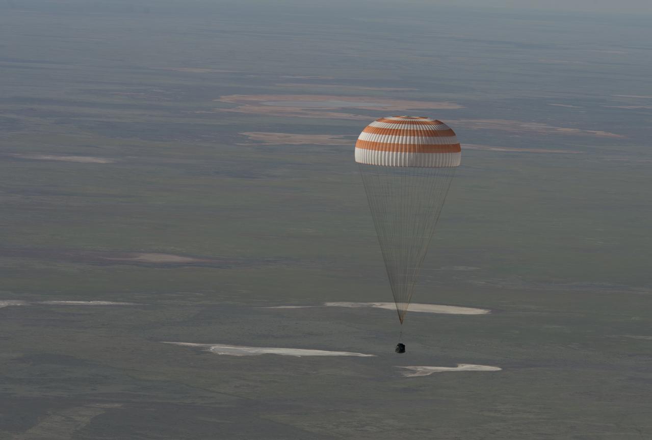 The Soyuz TMA-07M spacecraft is seen as it lands with Expedition 35 Commander Chris Hadfield of the Canadian Space Agency (CSA), NASA Flight Engineer Tom Marshburn and Russian Flight Engineer Roman Romanenko of the Russian Federal Space Agency (Roscosmos) in a remote area near the town of Zhezkazgan, Kazakhstan, on Tuesday, May 14, 2013.  Hadfield, Marshburn and Romanenko returned from five months onboard the International Space Station where they served as members of the Expedition 34 and 35 crews. Photo Credit:  (NASA/Carla Cioffi)