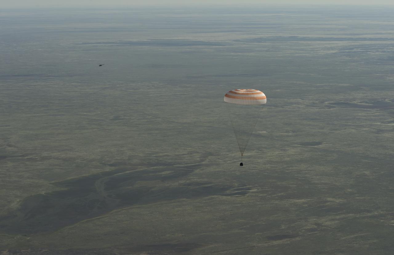 The Soyuz TMA-07M spacecraft is seen as it lands with Expedition 35 Commander Chris Hadfield of the Canadian Space Agency (CSA), NASA Flight Engineer Tom Marshburn and Russian Flight Engineer Roman Romanenko of the Russian Federal Space Agency (Roscosmos) in a remote area near the town of Zhezkazgan, Kazakhstan, on Tuesday, May 14, 2013.  Hadfield, Marshburn and Romanenko returned from five months onboard the International Space Station where they served as members of the Expedition 34 and 35 crews. Photo Credit:  (NASA/Carla Cioffi)