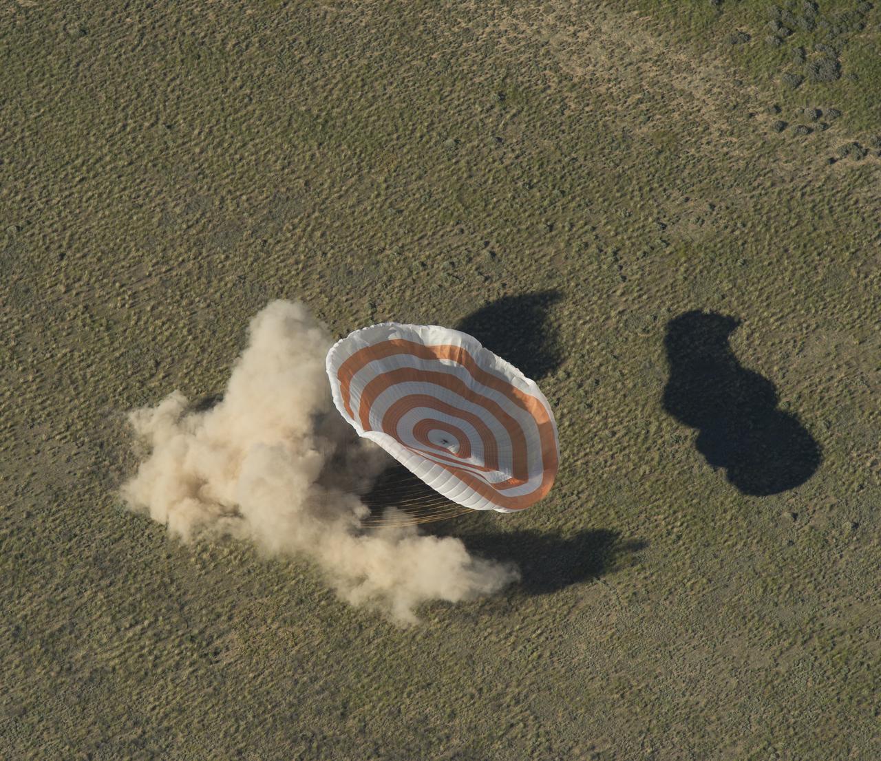 The Soyuz TMA-07M spacecraft is seen as it lands with Expedition 35 Commander Chris Hadfield of the Canadian Space Agency (CSA), NASA Flight Engineer Tom Marshburn and Russian Flight Engineer Roman Romanenko of the Russian Federal Space Agency (Roscosmos) in a remote area near the town of Zhezkazgan, Kazakhstan, on Tuesday, May 14, 2013.  Hadfield, Marshburn and Romanenko returned from five months onboard the International Space Station where they served as members of the Expedition 34 and 35 crews. Photo Credit:  (NASA/Carla Cioffi)
