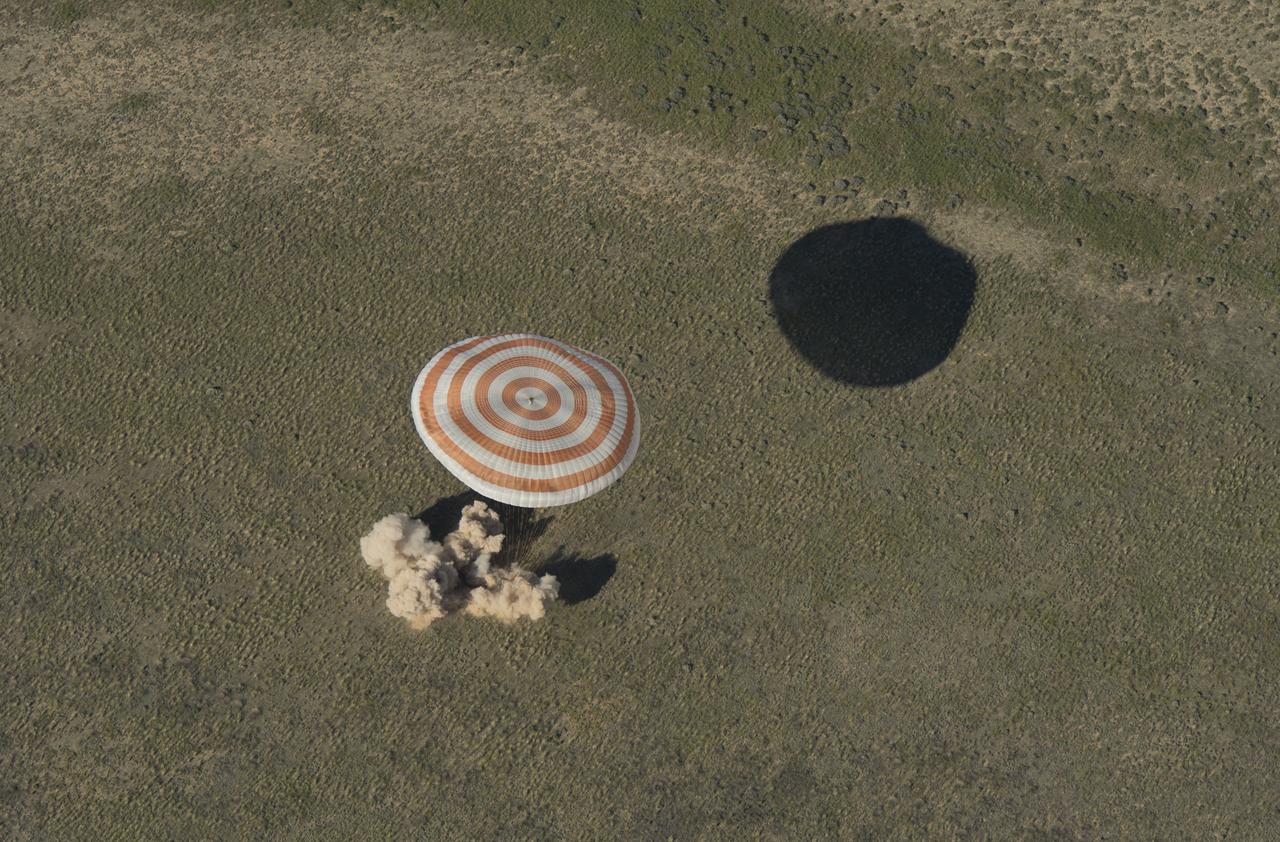 The Soyuz TMA-07M spacecraft is seen as it lands with Expedition 35 Commander Chris Hadfield of the Canadian Space Agency (CSA), NASA Flight Engineer Tom Marshburn and Russian Flight Engineer Roman Romanenko of the Russian Federal Space Agency (Roscosmos) in a remote area near the town of Zhezkazgan, Kazakhstan, on Tuesday, May 14, 2013.  Hadfield, Marshburn and Romanenko returned from five months onboard the International Space Station where they served as members of the Expedition 34 and 35 crews. Photo Credit:  (NASA/Carla Cioffi)