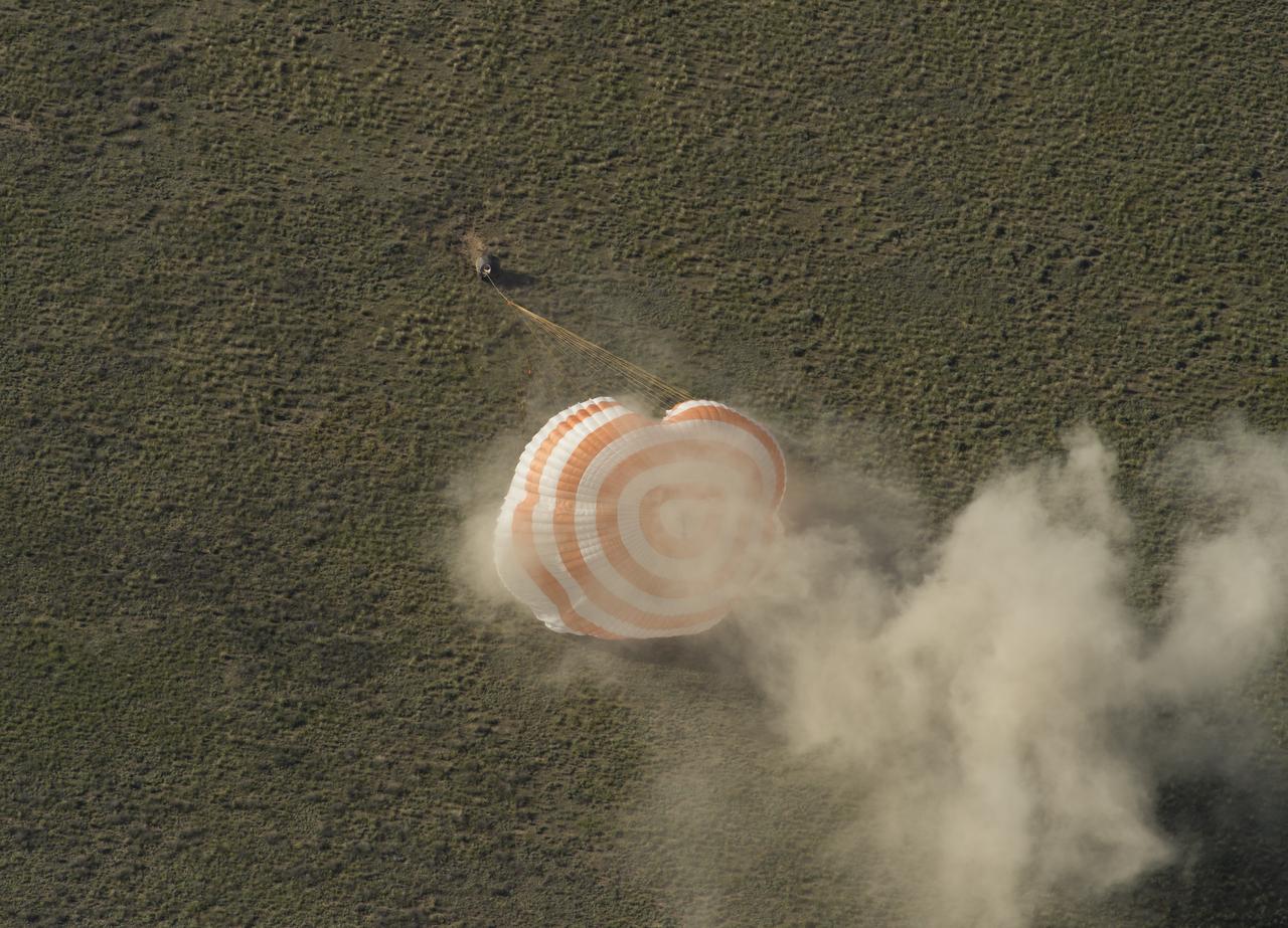 The Soyuz TMA-07M spacecraft is seen as it lands with Expedition 35 Commander Chris Hadfield of the Canadian Space Agency (CSA), NASA Flight Engineer Tom Marshburn and Russian Flight Engineer Roman Romanenko of the Russian Federal Space Agency (Roscosmos) in a remote area near the town of Zhezkazgan, Kazakhstan, on Tuesday, May 14, 2013.  Hadfield, Marshburn and Romanenko returned from five months onboard the International Space Station where they served as members of the Expedition 34 and 35 crews. Photo Credit:  (NASA/Carla Cioffi)