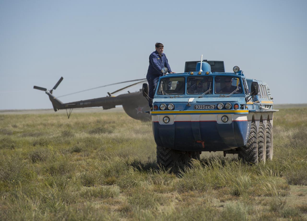 A Russian all terrain vehicle (ATV) takes Expedition 35 Commander Chris Hadfield of the Canadian Space Agency (CSA) to a helicopter from the Soyuz TMA-07M spacecraft shortly after the capsule landed with Hadfield and Expedition 35 Flight Engineers Tom Marshburn and Roman Romanenko in a remote area near the town of Zhezkazgan, Kazakhstan, Tuesday, May 14, 2013. Hadfield, Marshburn and Romanenko are returning from five months onboard the International Space Station where they served as members of the Expedition 34 and 35 crews.  Photo Credit: (NASA/Carla Cioffi)