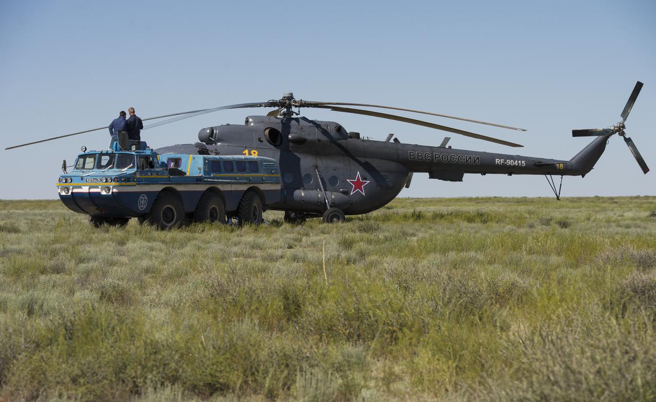 A Russian all terrain vehicle (ATV) takes Expedition 35 Commander Chris Hadfield of the Canadian Space Agency (CSA) to a helicopter from the Soyuz TMA-07M spacecraft shortly after the capsule landed with Hadfield and Expedition 35 Flight Engineers Tom Marshburn and Roman Romanenko in a remote area near the town of Zhezkazgan, Kazakhstan, Tuesday, May 14, 2013. Hadfield, Marshburn and Romanenko are returning from five months onboard the International Space Station where they served as members of the Expedition 34 and 35 crews.  Photo Credit: (NASA/Carla Cioffi)
