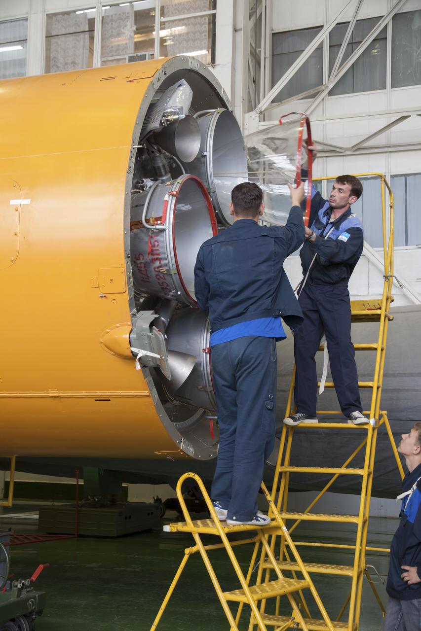 Engineers prepare a stage of the Soyuz rocket for assembly at the Baikonur Cosmodrome, Saturday, May 25, 2013, in Kazakhstan. The launch of the Soyuz rocket and TMA-09M spacecraft to the International Space Station (ISS) with Expedition 36/37 Soyuz Commander Fyodor Yurchikhin of the Russian Federal Space Agency (Roscosmos), Flight Engineers; Luca Parmitano of the European Space Agency, and Karen Nyberg of NASA, is scheduled for Wednesday May 29, Kazakh time. Yurchikhin, Nyberg, and, Parmitano, will remain aboard the station until mid-November. Photo credit: (NASA/Victor Zelentsov)