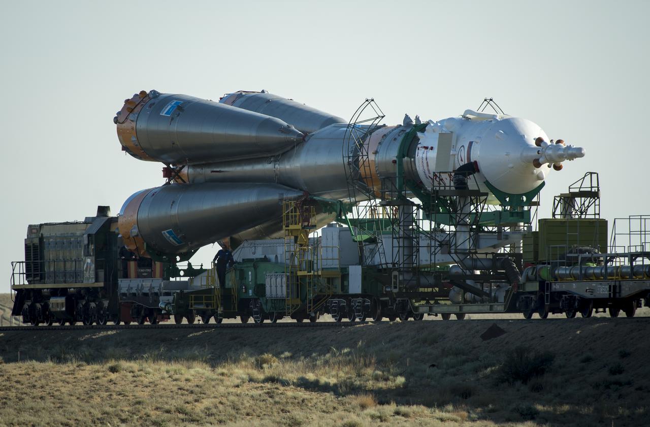 The Soyuz TMA-09M spacecraft is rolled out by train to the Baikonur Cosmodrome launch pad, Sunday, May 26, 2013, in Kazakhstan.  The launch of the Soyuz rocket to the International Space Station (ISS) with Expedition 36/37 Soyuz Commander Fyodor Yurchikhin of the Russian Federal Space Agency (Roscosmos), Flight Engineers; Luca Parmitano of the European Space Agency, and Karen Nyberg of NASA, is scheduled for Wednesday May 29, Kazakh time. Yurchikhin, Nyberg, and, Parmitano, will remain aboard the station until mid-November. Photo credit: (NASA/Bill Ingalls)