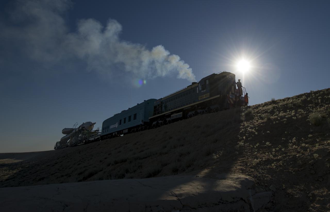 The Soyuz TMA-09M spacecraft is rolled out by train to the Baikonur Cosmodrome launch pad, Sunday, May 26, 2013, in Kazakhstan.  The launch of the Soyuz rocket to the International Space Station (ISS) with Expedition 36/37 Soyuz Commander Fyodor Yurchikhin of the Russian Federal Space Agency (Roscosmos), Flight Engineers; Luca Parmitano of the European Space Agency, and Karen Nyberg of NASA, is scheduled for Wednesday May 29, Kazakh time. Yurchikhin, Nyberg, and, Parmitano, will remain aboard the station until mid-November. Photo credit: (NASA/Bill Ingalls)