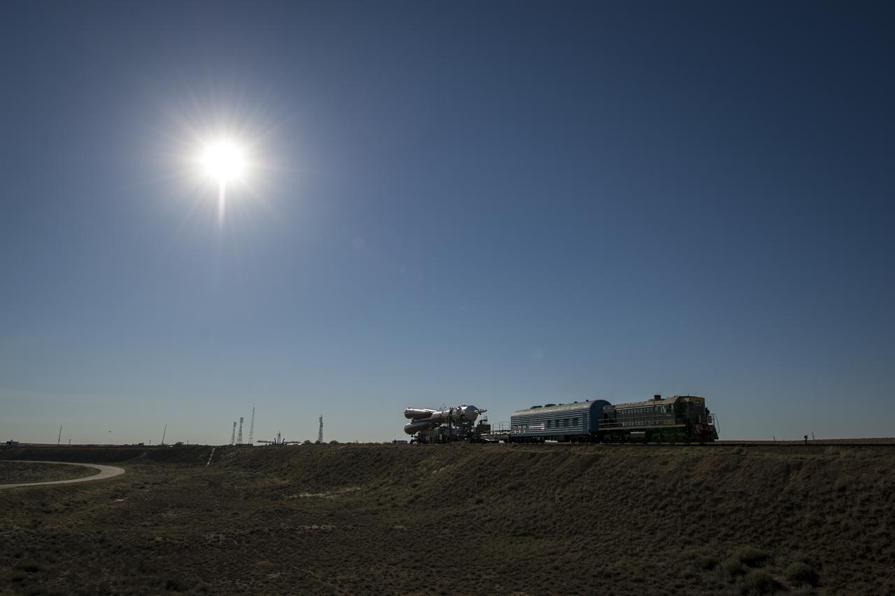 The Soyuz TMA-09M spacecraft is rolled out by train to the Baikonur Cosmodrome launch pad, Sunday, May 26, 2013, in Kazakhstan. The launch of the Soyuz rocket to the International Space Station (ISS) with Expedition 36/37 Soyuz Commander Fyodor Yurchikhin of the Russian Federal Space Agency (Roscosmos), Flight Engineers; Luca Parmitano of the European Space Agency, and Karen Nyberg of NASA, is scheduled for Wednesday May 29, Kazakh time. Yurchikhin, Nyberg, and, Parmitano, will remain aboard the station until mid-November. Photo credit: (NASA/Bill Ingalls)