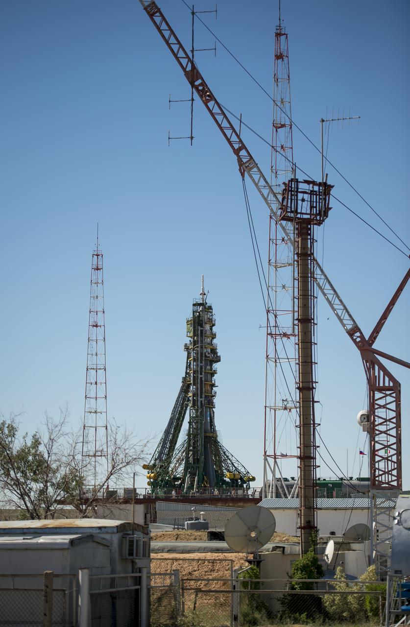 The Soyuz rocket, with the TMA-09M spacecraft, is seen after arriving at the Baikonur Cosmodrome launch pad by train, Sunday, May 26, 2013, in Kazakhstan.  The launch of the Soyuz rocket to the International Space Station (ISS) with Expedition 36/37 Soyuz Commander Fyodor Yurchikhin of the Russian Federal Space Agency (Roscosmos), Flight Engineers; Luca Parmitano of the European Space Agency, and Karen Nyberg of NASA, is scheduled for Wednesday May 29, Kazakh time. Yurchikhin, Nyberg, and, Parmitano, will remain aboard the station until mid-November. Photo credit: (NASA/Bill Ingalls)