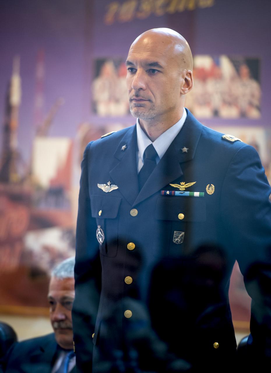 Expedition 36/37 Flight Engineer Luca Parmitano of the European Space Agency stands during the State Commission meeting at the Cosmonaut Hotel, Monday, May 27, 2013, in Kazakhstan. Parmitano and his fellow crew members, Soyuz Commander Fyodor Yurchikhin of the Russian Federal Space Agency (Roscosmos), and Flight Engineer Karen Nyberg of NASA, were in quarantine and kept behind glass during the meeting in preparation for their launch on a Soyuz rocket to the International Space Station (ISS) on Wednesday May 29, Kazakh time. Photo credit: (NASA/Bill Ingalls)