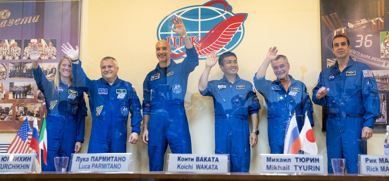 From left, Expedition 36/37 Flight Engineer Karen Nyberg of NASA, Soyuz Commander Fyodor Yurchikhin of the Russian Federal Space Agency (Roscosmos), Flight Engineer Luca Parmitano of the European Space Agency, and Expedition 36/37 backup crew members; Koichi Wakata of the Japan Aerospace Exploration Agency, Mikhail Tyurin of the Russian Federal Space Agency (Roscosmos), and Rick Mastracchio of NASA are seen during the crew's press conference at the Cosmonaut Hotel, Monday, May 27, 2013, in Kazakhstan. The crew is in quarantine and behind glass during the press conference in preparation for their launch on a Soyuz rocket to the International Space Station (ISS) on Wednesday May 29, Kazakh time. Yurchikhin, Nyberg, and, Parmitano, will remain aboard the station until mid-November. Photo credit: (NASA/Bill Ingalls)