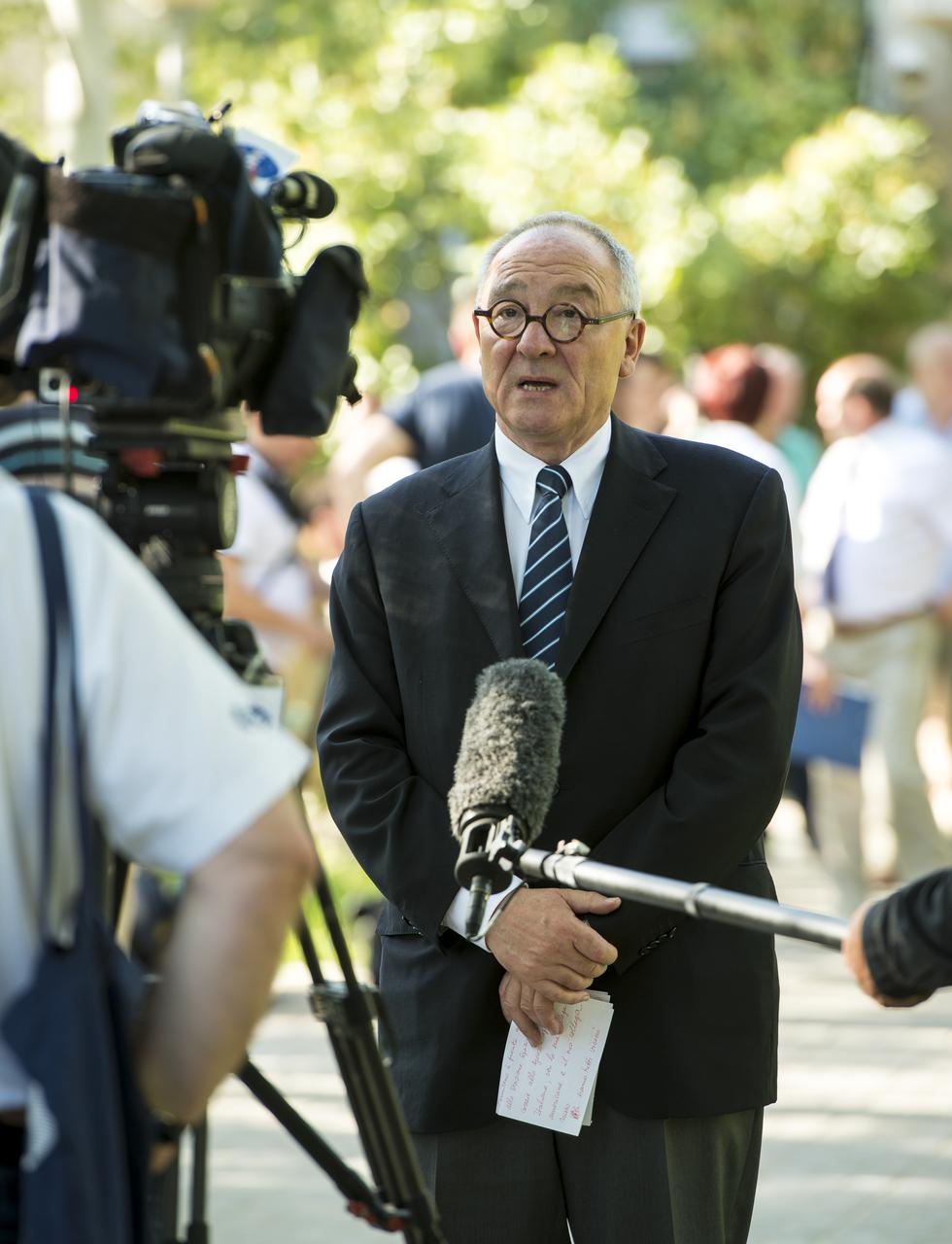 Jean-Jacques Dordain, ESA Director-General, is seen giving a television interview shortly after the State Commission meeting to approve the Soyuz launch of Expedition 36 Soyuz Commander Fyodor Yurchikhin of the Russian Federal Space Agency (Roscosmos), Flight Engineers; Karen Nyberg of NASA, and Luca Parmitano of the European Space Agency at the Cosmonaut Hotel, Monday, May 27, 2013, in Kazakhstan. Photo credit: (NASA/Bill Ingalls)