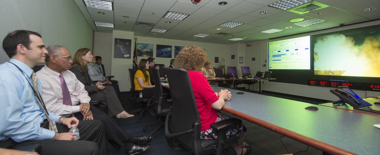 NASA Administrator Charles Bolden (second from left) and NASA Deputy Administrator Lori Garver (third from left) watch a live feed from Baikonur, Kazakhstan of the launch of the Soyuz TMA-09M spacecraft carrying the Expedition 36 crew to the International Space Station on Tuesday, May 28, 2013 at NASA Headquarters in Washington. The Expedition 36 crew of Soyuz Commander Fyodor Yurchikhin of the Russian Federal Space Agency, NASA Flight Engineer Karen Nyberg and Flight Engineer Luca Parmitano of the European Space Agency launched from the Baikonur Cosmodrome in Kazakhstan at 2:31 a.m. local time Wednesday, May 29, 4:31 p.m. on Tuesday, May 28 EST. The crew will spend five months living and working aboard the ISS. Photo credit: (NASA/Carla Cioffi)
