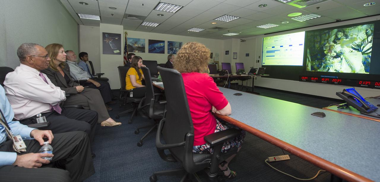 NASA Administrator Charles Bolden (second from left) and NASA Deputy Administrator Lori Garver (third from left) watch a live feed from Baikonur, Kazakhstan of the Expedition 36 crew aboard the Soyuz TMA-09M spacecraft moments after it launched to the International Space Station on Tuesday, May 28, 2013 at NASA Headquarters in Washington. The Expedition 36 crew of Soyuz Commander Fyodor Yurchikhin of the Russian Federal Space Agency, NASA Flight Engineer Karen Nyberg and Flight Engineer Luca Parmitano of the European Space Agency launched from the Baikonur Cosmodrome in Kazakhstan at 2:31 a.m. local time Wednesday, May 29/4:31 p.m. on Tuesday, May 28 EST. The crew will spend five months living and working aboard the ISS. Photo credit: (NASA/Carla Cioffi)