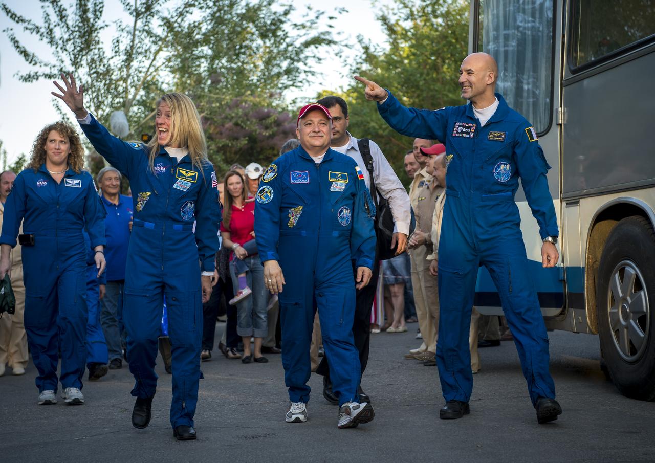 Expedition 36/37 Flight Engineer Karen Nyberg of NASA, left, Soyuz Commander Fyodor Yurchikhin of the Russian Federal Space Agency (Roscosmos), center, and Flight Engineer Luca Parmitano of the European Space Agency depart the Cosmonaut Hotel, Tuesday, May 28, 2013, in Baikonur, Kazakhstan. Nyberg, Yurichikin, and Parmitano departed the hotel in preparation for their launch on a Soyuz rocket to the International Space Station (ISS) on Wednesday May 29, Kazakh time. Photo credit: (NASA/Bill Ingalls)