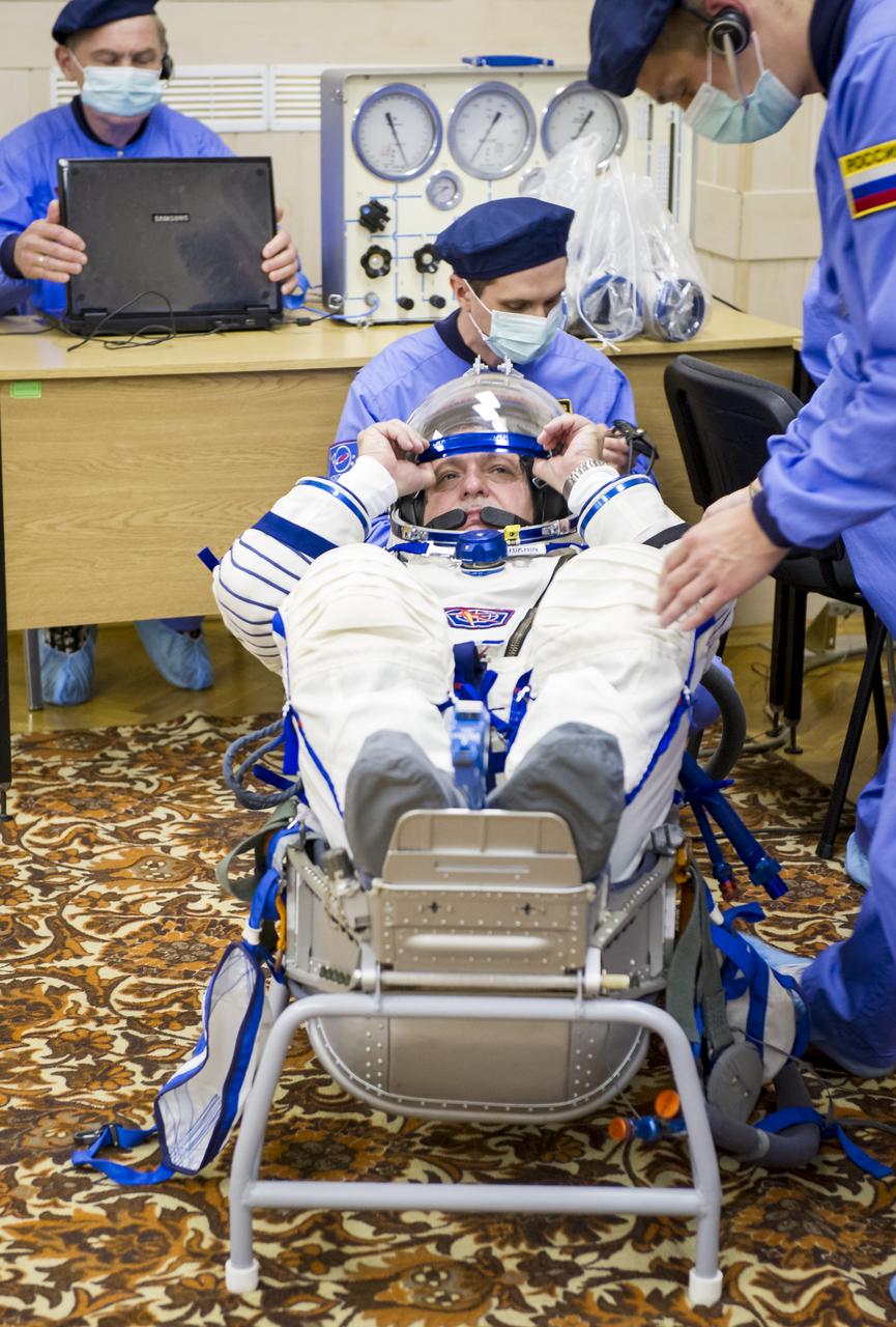 Expedition 36 NASA Soyuz Commander Fyodor Yurchikhin has his Russian Sokol suit pressure checked ahead of his launch onboard a Soyuz TMA-09M spacecraft to the International Space Station, Tuesday, May 28, 2013, at the Baikonur Cosmodrome in Kazakhstan.  Launch of the Soyuz rocket will send Yurchikhin, NASA Flight Engineer Karen Nyberg and European Space Agency Flight Engineer Luca Parmitano on a five and a half-month mission aboard the International Space Station.  Photo Credit: (NASA/GCTC/Andrey Shelepin)