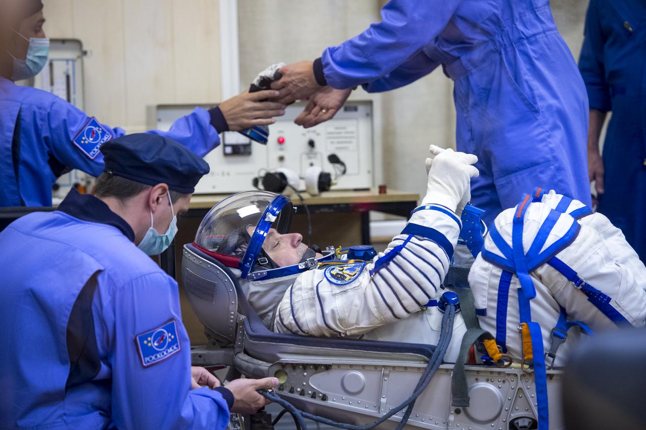 Expedition 36 NASA Soyuz Commander Fyodor Yurchikhin has his Russian Sokol suit pressure checked ahead of his launch onboard a Soyuz TMA-09M spacecraft to the International Space Station, Tuesday, May 28, 2013, at the Baikonur Cosmodrome in Kazakhstan. Launch of the Soyuz rocket will send Yurchikhin, NASA Flight Engineer Karen Nyberg and European Space Agency Flight Engineer Luca Parmitano on a five and a half-month mission aboard the International Space Station. Photo Credit: (NASA/Bill Ingalls)
