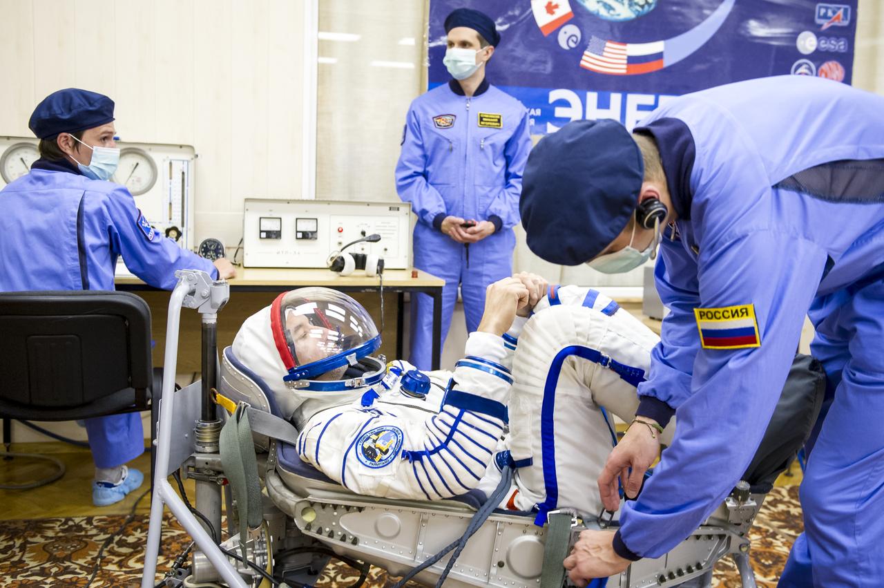 Expedition 36 European Space Agency Flight Engineer Luca Parmitano has his Russian Sokol suit pressure checked ahead of his launch onboard a Soyuz TMA-09M spacecraft to the International Space Station, Tuesday, May 28, 2013, at the Baikonur Cosmodrome in Kazakhstan. Launch of the Soyuz rocket will send Parmitano, Soyuz Commander Fyodor Yurchikhin and NASA Flight Engineer Karen Nyberg on a five and a half-month mission aboard the International Space Station. Photo Credit: (NASA/GCTC/Andrey Shelepin)
