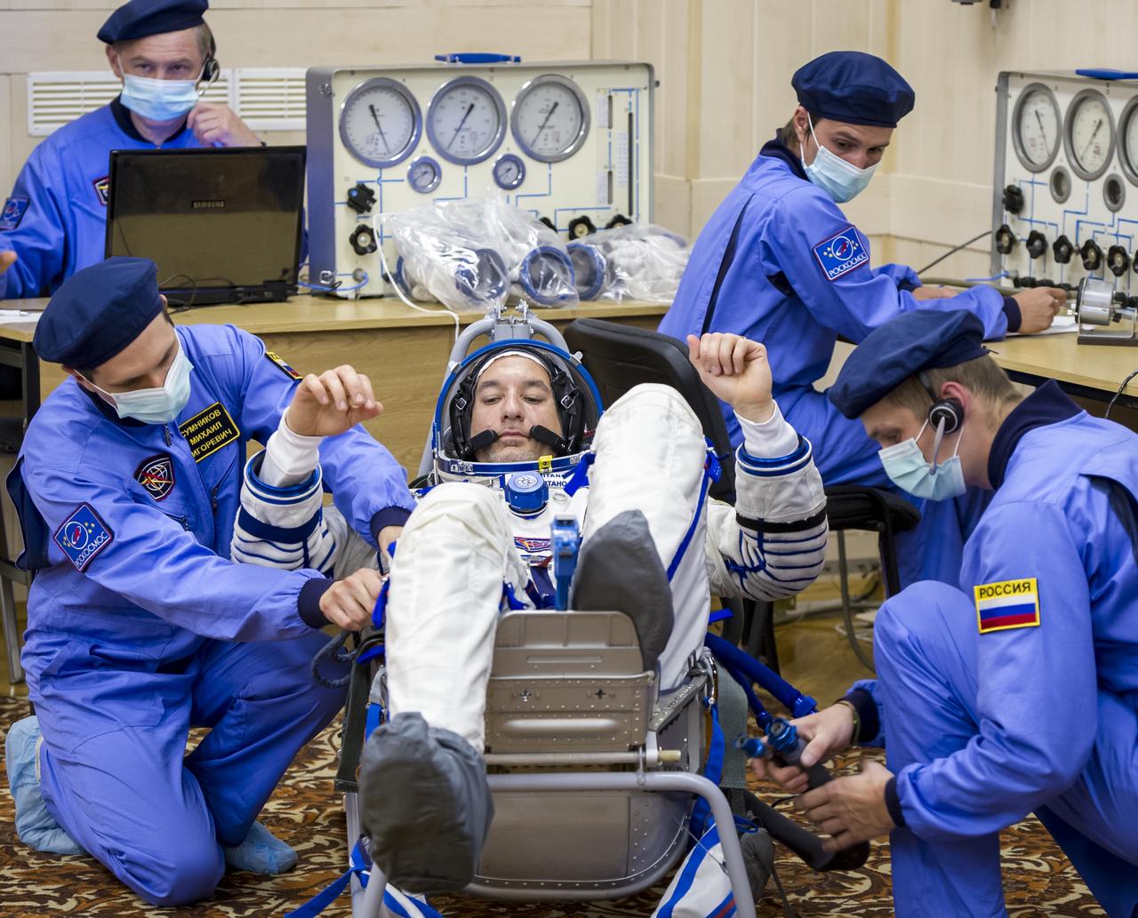 Expedition 36 European Space Agency Flight Engineer Luca Parmitano has his Russian Sokol suit pressure checked ahead of his launch onboard a Soyuz TMA-09M spacecraft to the International Space Station, Tuesday, May 28, 2013, at the Baikonur Cosmodrome in Kazakhstan. Launch of the Soyuz rocket will send Parmitano, Soyuz Commander Fyodor Yurchikhin and NASA Flight Engineer Karen Nyberg on a five and a half-month mission aboard the International Space Station. Photo Credit: (NASA/GCTC/Andrey Shelepin)