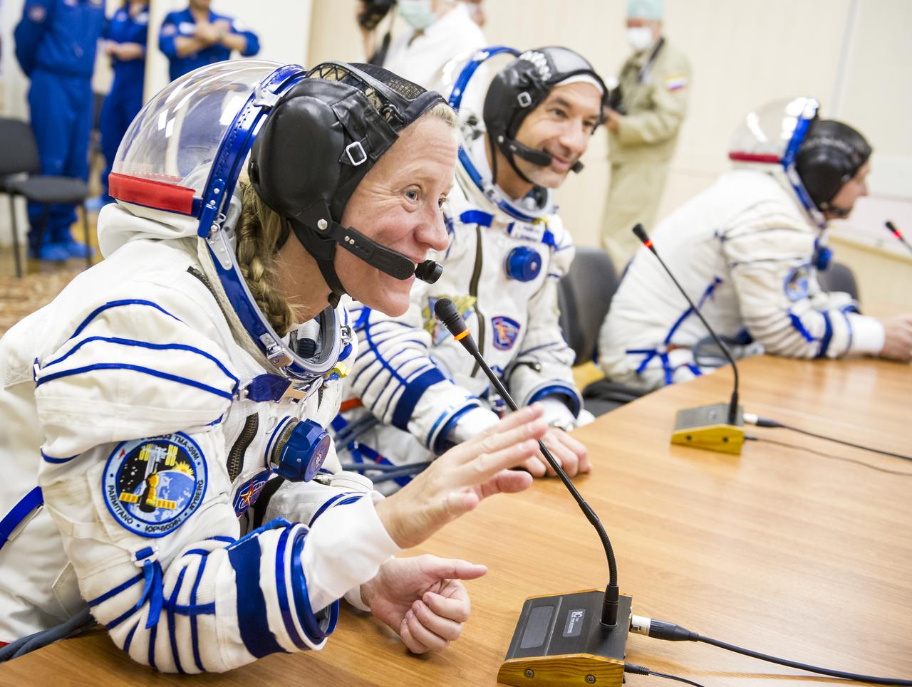 Expedition 36 NASA Flight Engineer Karen Nyberg is seen talking to family members after donning her Russian Sokol suit in preparation for her launch aboard the Soyuz rocket, Tuesday, May 28, 2013, at the Baikonur Cosmodrome in Kazakhstan.  Launch of the Soyuz rocket will send Nyberg, Soyuz Commander Fyodor Yurchikhin and European Space Agency Flight Engineer Luca Parmitano on a five and a half-month mission aboard the International Space Station.  Photo Credit: (NASA/GCTC/Andrey Shelepin)
