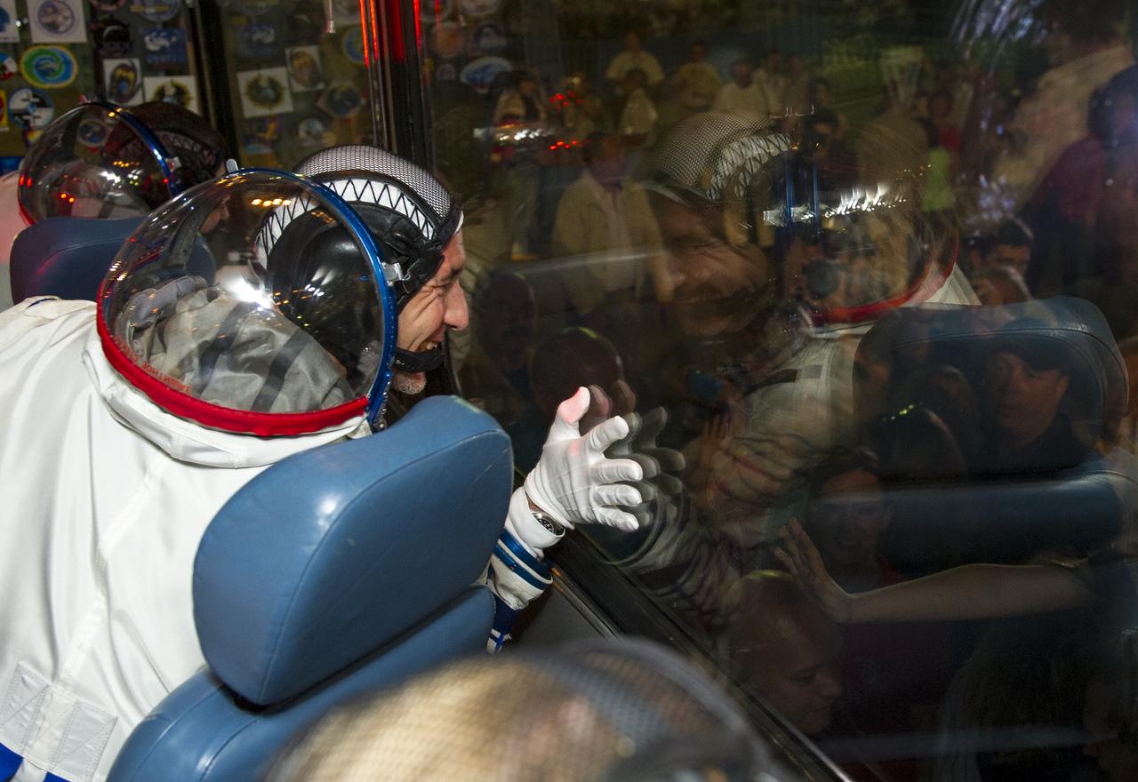 Expedition 36 European Space Agency Flight Engineer Luca Parmitano is seen waving goodbye to friends and family after boarding the bus that will take him to the Soyuz launch pad hours ahead of his launch, Tuesday, May 28, 2013 at the Baikonur Cosmodrome in Kazakhstan. Launch of the Soyuz rocket will send Parmitano, Soyuz Commander Fyodor Yurchikhin and Flight Engineer Karen Nyberg on a five and a half-month mission aboard the International Space Station. Photo Credit: (NASA/GCTC/Andrey Shelepin)