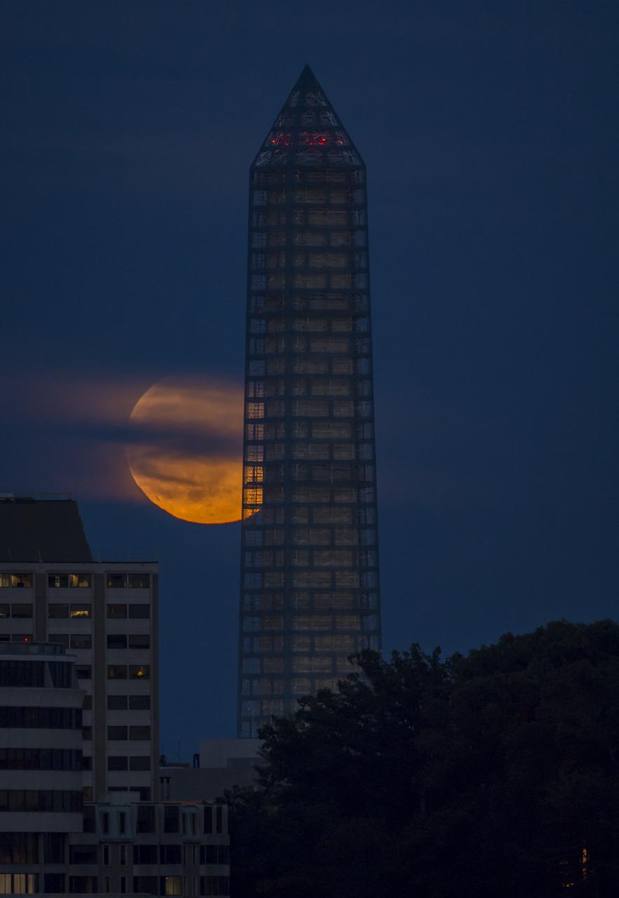 A supermoon rises behind the Washington Monument, Sunday, June 23, 2013, in Washington. This year the Supermoon is up to 13.5% larger and 30% brighter than a typical Full Moon is. This is a result of the Moon reaching its perigee - the closest that it gets to the Earth during the course of its orbit. During perigee on 23 June the Moon was about 221,824 miles away, as compared to the 252,581 miles away that it is at its furthest distance from the Earth (apogee). Photo Credit: (NASA/Bill Ingalls)