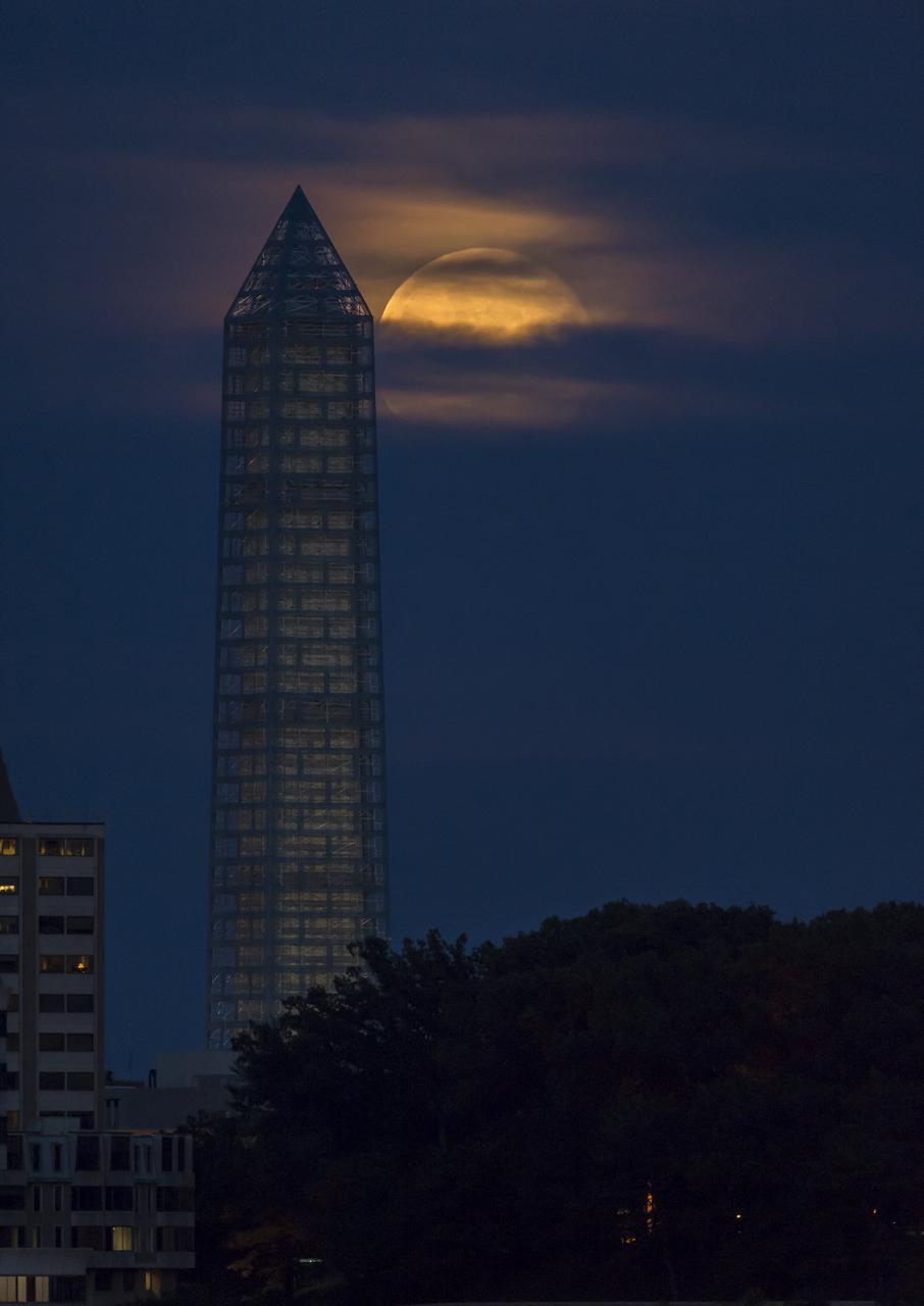 A supermoon rises behind the Washington Monument, Sunday, June 23, 2013, in Washington. This year the Supermoon is up to 13.5% larger and 30% brighter than a typical Full Moon is. This is a result of the Moon reaching its perigee - the closest that it gets to the Earth during the course of its orbit. During perigee on 23 June the Moon was about 221,824 miles away, as compared to the 252,581 miles away that it is at its furthest distance from the Earth (apogee). Photo Credit: (NASA/Bill Ingalls)