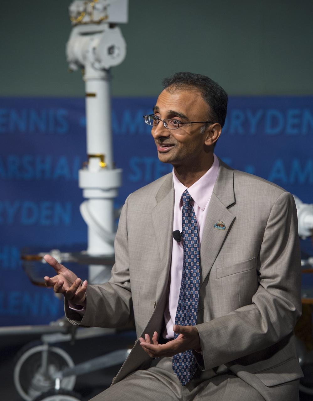 Prasun Desai, acting director, Strategic Integration, NASA's Space Technology Mission Directorate, speaks at a public event at NASA Headquarters observing the first anniversary of the Curiosity rover's landing on Mars, Tuesday, August 6th, 2013 in Washington.  The Mars Science Laboratory mission successfully placed the one-ton Curiosity rover on the surface of Mars on Aug. 6, 2012, about 1 mile from the center of its 12-mile-long target area.  Within the first eight months of a planned 23-months primary mission, Curiosity met its major science objective of finding evidence of a past environment well-suited to support microbial life.  Photo Credit: (NASA/Carla Cioffi)