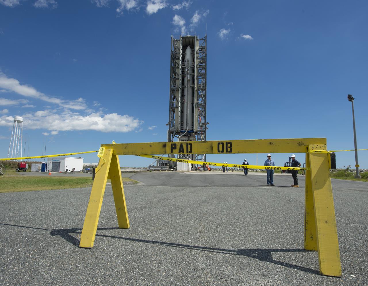 The doors of the gantry support structure are opened to reveal the Minotaur V rocket on Pad 0B at the Mid-Atlantic Regional Spaceport (MARS) at NASA's Wallops Flight Facility, Friday, Sept. 6, 2013 in Virginia.  The Minotaur V will launch NASA's Lunar Atmosphere and Dust Environment Explorer (LADEE).  LADEE is a robotic mission that will orbit the moon where it will provide unprecedented information about the environment around the moon and give scientists a better understanding of other planetary bodies in our solar system and beyond.  LADEE is scheduled to launch at 11:27 p.m. Friday, Sept. 6, from NASA's Wallops Flight Facility.  Photo Credit: (NASA/Carla Cioffi)