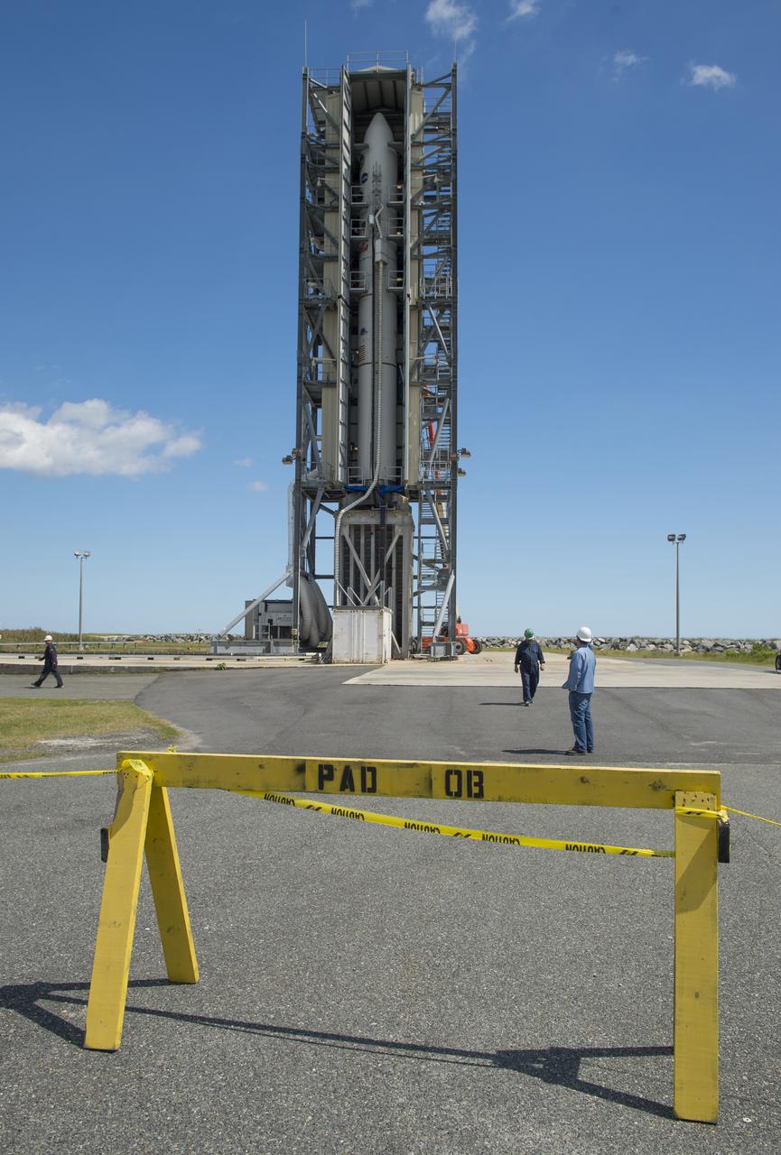 The doors of the gantry support structure are opened to reveal the Minotaur V rocket on Pad 0B at the Mid-Atlantic Regional Spaceport (MARS) at NASA's Wallops Flight Facility, Friday, Sept. 6, 2013 in Virginia.  The Minotaur V will launch NASA's Lunar Atmosphere and Dust Environment Explorer (LADEE).  LADEE is a robotic mission that will orbit the moon where it will provide unprecedented information about the environment around the moon and give scientists a better understanding of other planetary bodies in our solar system and beyond.  LADEE is scheduled to launch at 11:27 p.m. Friday, Sept. 6, from NASA's Wallops Flight Facility.  Photo Credit: (NASA/Carla Cioffi)