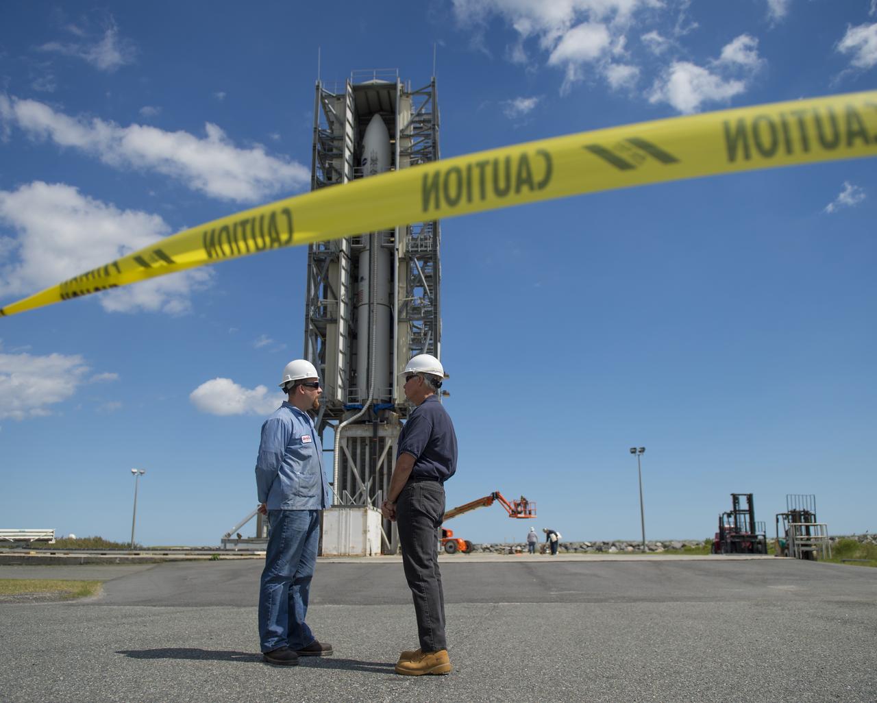 The doors of the gantry support structure are opened to reveal the Minotaur V rocket on Pad 0B at the Mid-Atlantic Regional Spaceport (MARS) at NASA's Wallops Flight Facility, Friday, Sept. 6, 2013 in Virginia.  The Minotaur V will launch NASA's Lunar Atmosphere and Dust Environment Explorer (LADEE).  LADEE is a robotic mission that will orbit the moon where it will provide unprecedented information about the environment around the moon and give scientists a better understanding of other planetary bodies in our solar system and beyond.  LADEE is scheduled to launch at 11:27 p.m. Friday, Sept. 6, from NASA's Wallops Flight Facility.  Photo Credit: (NASA/Carla Cioffi)