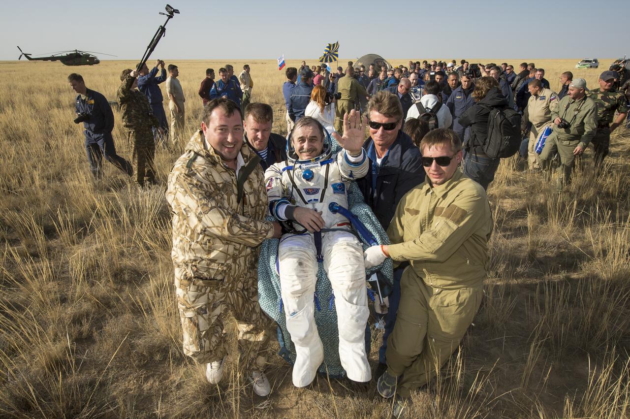 Expedition 36 Commander Pavel Vinogradov of the Russian Federal Space Agency (Roscosmos) is carried to the medical tent shortly after he and, Flight Engineer Alexander Misurkin of Roscosmos and Flight Engineer Chris Cassidy of NASA landed in their Soyuz TMA-08M capsule in a remote area near the town of Zhezkazgan, Kazakhstan, on Wednesday, Sept. 11, 2013. Vinogradov, Misurkin and Cassidy returned to Earth after five and a half months on the International Space Station. Photo Credit: (NASA/Bill Ingalls)