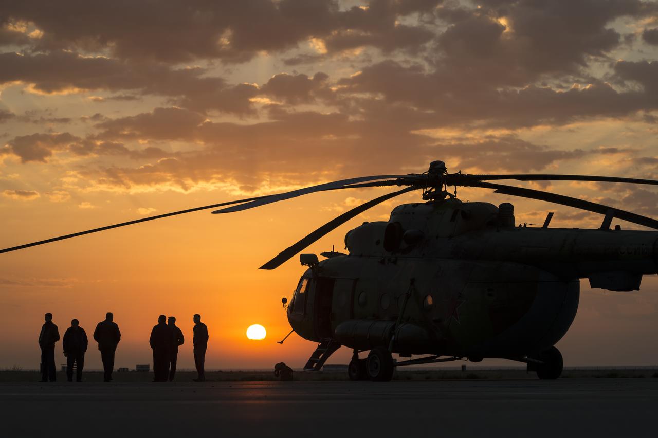A Russian search and rescue helicopter and crew wait to depart the Zhezkazgan airport in Kazakhstan to support the landing of the Soyuz TMA-08M spacecraft with Expedition 36 Commander Pavel Vinogradov of the Russian Federal Space Agency (Roscosmos), Flight Engineer Alexander Misurkin of Roscosmos and Flight Engineer Chris Cassidy, Wednesday, Sept. 11, 2013. Vinogradov, Misurkin and Cassidy are returning to Earth after five and a half months on the International Space Station. Photo Credit: (NASA/Bill Ingalls)
