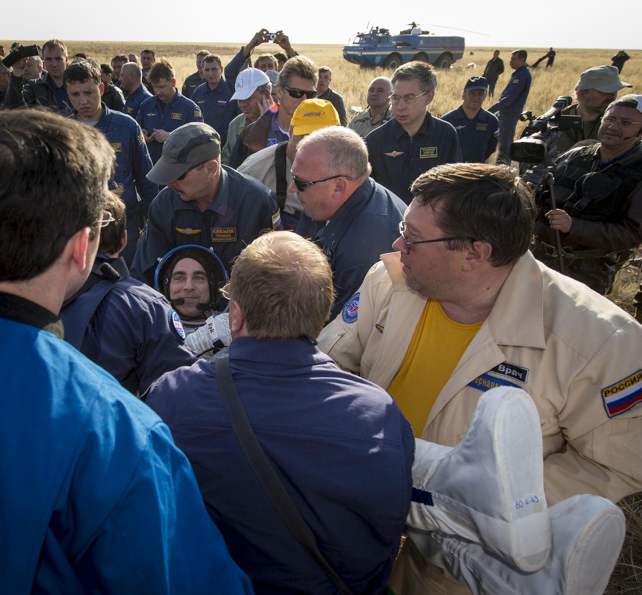 Expedition 36 Flight Engineer Chris Cassidy of NASA is helped out of the Soyuz TMA-08M capsule after he and, Commander Pavel Vinogradov of Russian Federal Space Agency (Roscosmos), and Flight Engineer Alexander Misurkin of Roscosmos landed in a Soyuz TMA-08M spacecraft  in a remote area near the town of Zhezkazgan, Kazakhstan, on Wednesday, Sept. 11, 2013. Vinogradov, Misurkin and Cassidy returned to Earth after five and a half months on the International Space Station. Photo Credit: (NASA/Bill Ingalls)