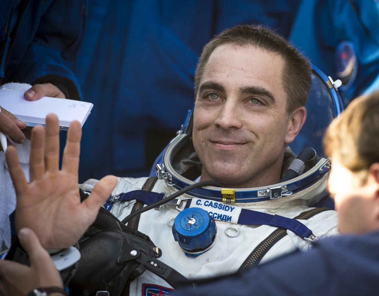 Expedition 36 Flight Engineer Chris Cassidy waves hello after he and, Commander Pavel Vinogradov of Russian Federal Space Agency (Roscosmos), and Flight Engineer Alexander Misurkin of Roscosmos landed their Soyuz TMA-08M spacecraft in a remote area near the town of Zhezkazgan, Kazakhstan, on Wednesday, Sept. 11, 2013. Vinogradov, Misurkin and Cassidy returned to Earth after five and a half months on the International Space Station. Photo Credit: (NASA/Bill Ingalls)