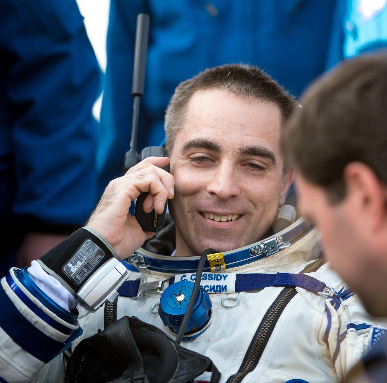 201309110037hq (Sept. 10, 2013) --- Expedition 36 Flight Engineer and NASA astronaut Chris Cassidy is on the phone with family shortly after parachuting to Earth inside the Soyuz TMA-08 spacecraft with fellow crewmates (out of frame) Pavel Vinogradov and Alexander Misurkin, both from Roscosmos.