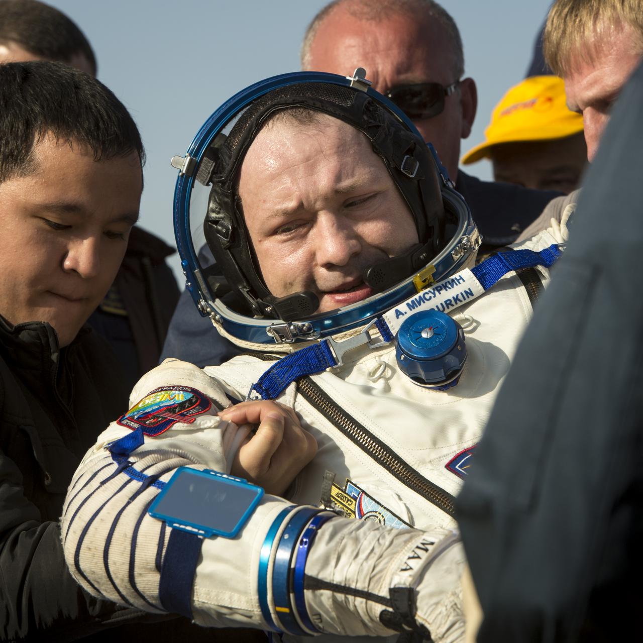 Expedition 36 Flight Engineer Alexander Misurkin of the Russian Federal Space Agency (Roscosmos) is carried from the Soyuz TMA-08M capsule to a chair to rest after he and, Commander Pavel Vinogradov of Roscosmos, and Flight Engineer Chris Cassidy of NASA landed in a remote area near the town of Zhezkazgan, Kazakhstan, on Wednesday, Sept. 11, 2013. Vinogradov, Misurkin and Cassidy returned to Earth after five and a half months on the International Space Station. Photo Credit: (NASA/Bill Ingalls)