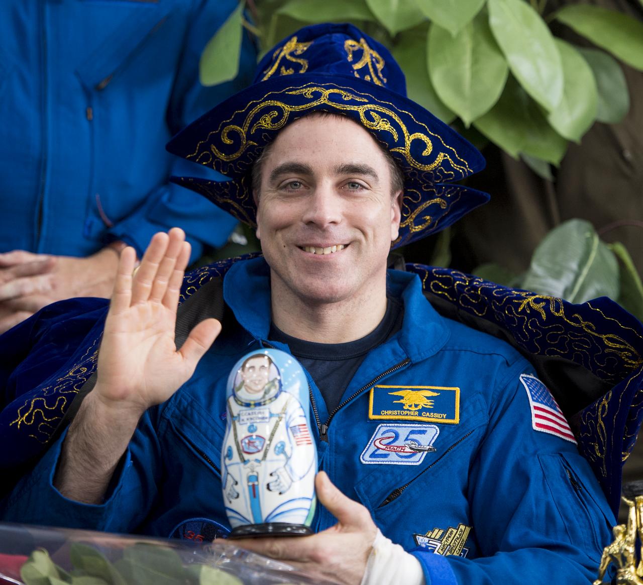 Expedition 36 Flight Engineer Chris Cassidy of NASA waves during a ceremony at the Karaganda airport in Kazakhstan after having been flown from the Soyuz TMA-08M spacecraft landing site in a remote area near the town of Zhezkazgan, Wednesday, Sept. 11, 2013. Cassidy, Commander Pavel Vinogradov of Russian Federal Space Agency (Roscosmos), and Flight Engineer Alexander Misurkin of Roscosmos returned to Earth after five and a half months on the International Space Station. Photo Credit: (NASA/Bill Ingalls)