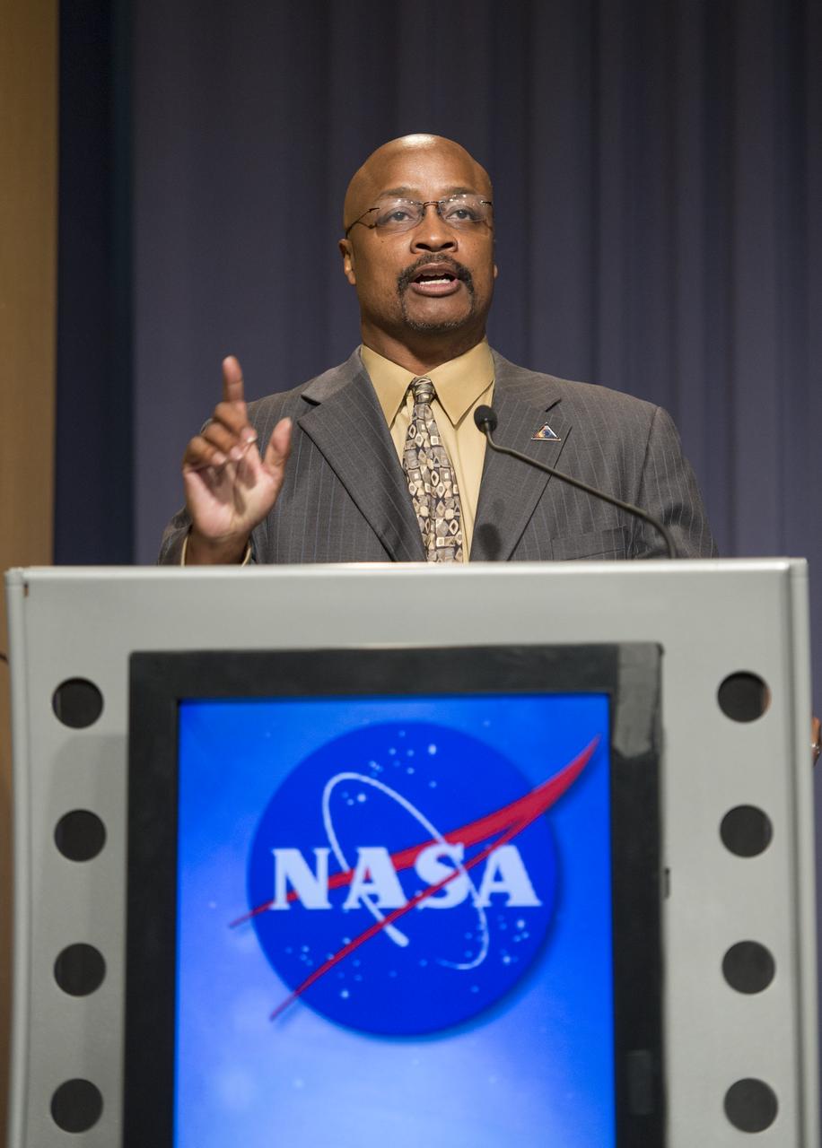 Dwayne Brown, Senior Public Affairs Officer, NASA Science Mission Directorate at NASA Headquarters, kicks off a news conference on NASA's Voyager 1 spacecraft, Thursday, Sept. 12, 2013 in Washington.  NASA's Voyager 1 spacecraft officially is the first human-made object to venture into interstellar space. The 36-year-old probe is about 12 billion miles (19 billion kilometers) from our sun.  New and unexpected data indicate Voyager 1 has been traveling for about one year through plasma, or ionized gas, present in the space between stars.  A report on the analysis of this new data is published in Thursday's edition of the journal Science.  Photo Credit:  (NASA/Carla Cioffi)