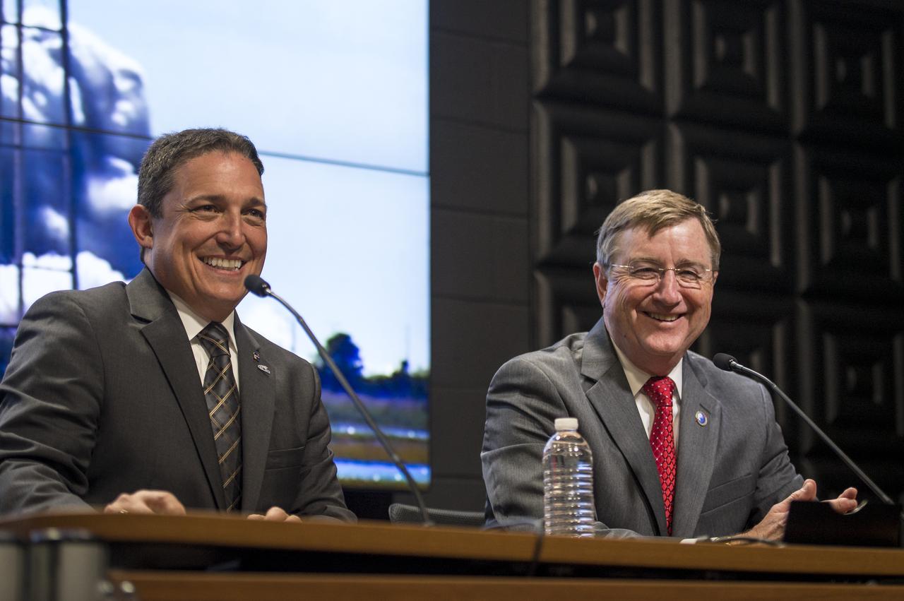 Alan Lindenmoyer, program manager, NASA's Commercial Crew and Cargo Program, left, and, Frank Culbertson, executive vice president, Orbital Sciences Corporation,are seen during a press conference held after the successful launch of the Orbital Sciences Antares rocket, with the Cygnus cargo spacecraft aboard, Wednesday, Sept. 18, 2013, NASA Wallops Flight Facility, Virginia. Cygnus is on its way to rendezvous with the space station. The spacecraft will deliver about 1,300 pounds (589 kilograms) of cargo, including food and clothing, to the Expedition 37 crew. Photo Credit: (NASA/Bill Ingalls)