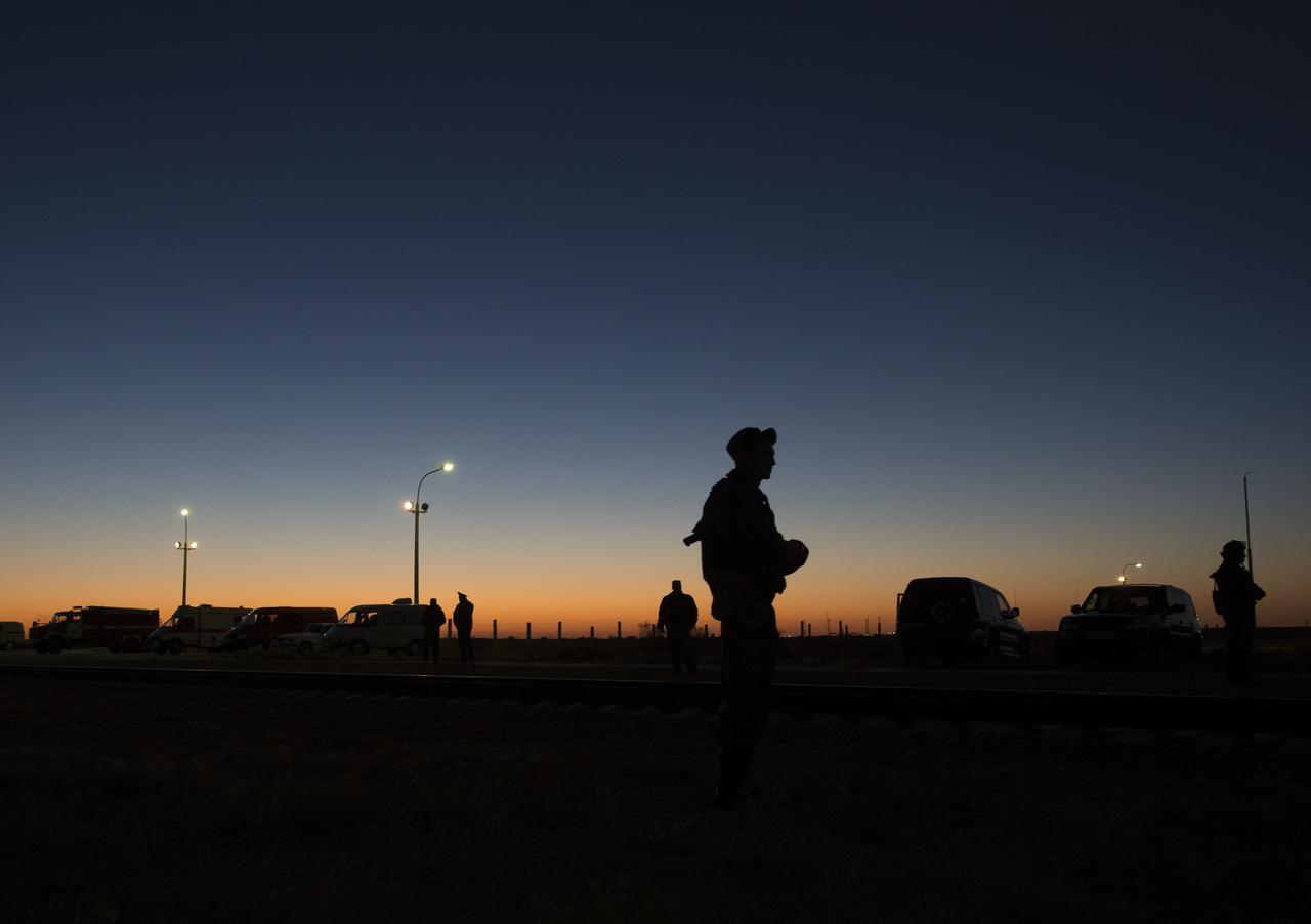 A Russian security guard is seen at sunrise on Monday, Sept. 23, 2013, at the Baikonur Cosmodrome in Kazakhstan. Launch of the Soyuz rocket is scheduled for September 26 and will send Expedition 37 Oleg Kotov, NASA Flight Engineer Michael Hopkins and Russian Flight Engineer Sergei Ryazansky on a five and a half-month mission aboard the International Space Station.  Photo Credit: (NASA/Carla Cioffi)