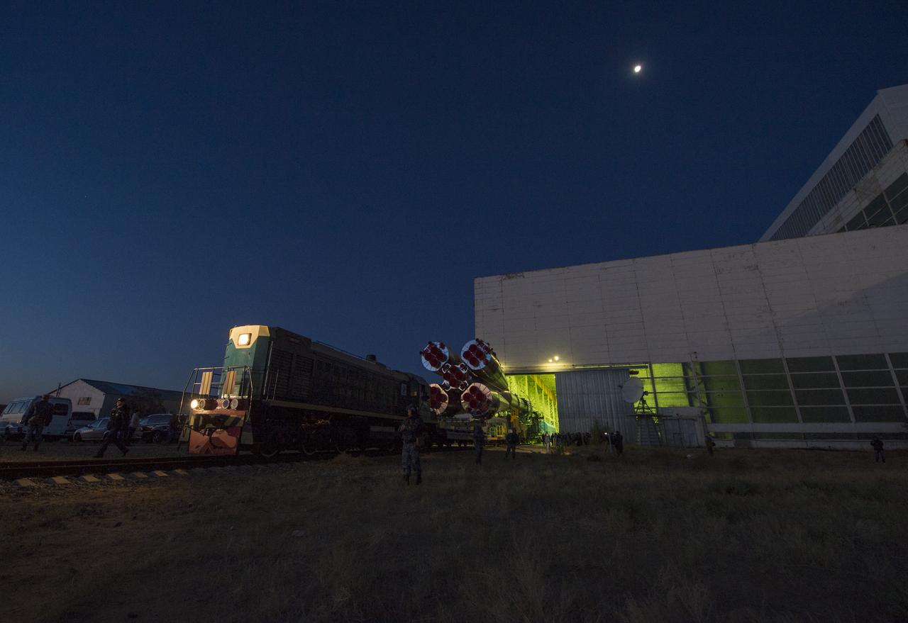 The Soyuz rocket is rolled out of Building 112 at the Baikonur Cosmodrome to make its way to the launch pad, Monday, Sept. 23, 2013 in Kazakhstan. Launch of the Soyuz rocket is scheduled for September 26 and will send Expedition 37 Oleg Kotov, NASA Flight Engineer Michael Hopkins and Russian Flight Engineer Sergei Ryazansky on a five and a half-month mission aboard the International Space Station.  Photo Credit: (NASA/Carla Cioffi)