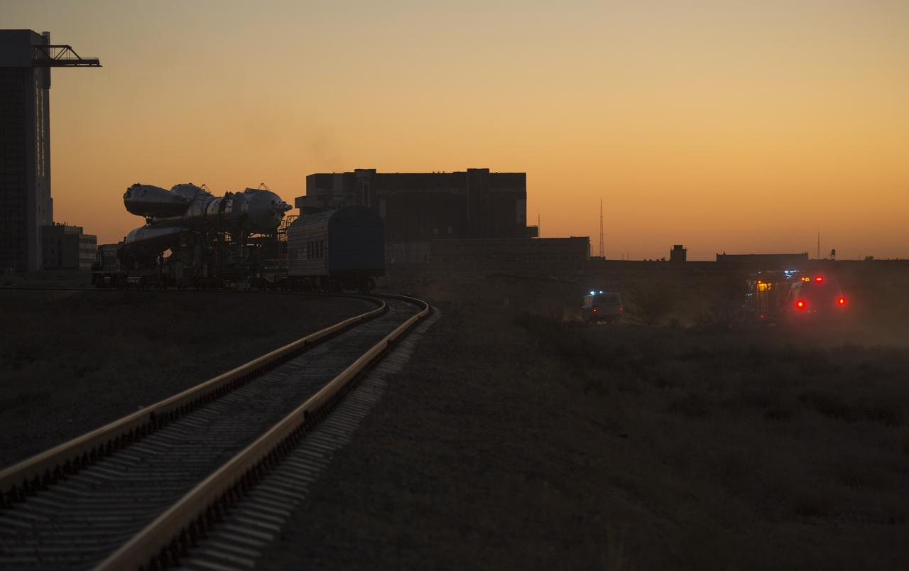 The Soyuz rocket is rolled out to the launch pad by train on Monday, Sept. 23, 2013, at the Baikonur Cosmodrome in Kazakhstan. Launch of the Soyuz rocket is scheduled for September 26 and will send Expedition 37 Soyuz Commander Oleg Kotov, NASA Flight Engineer Michael Hopkins and Russian Flight Engineer Sergei Ryazansky on a five and a half-month mission aboard the International Space Station.  Photo Credit: (NASA/Carla Cioffi)