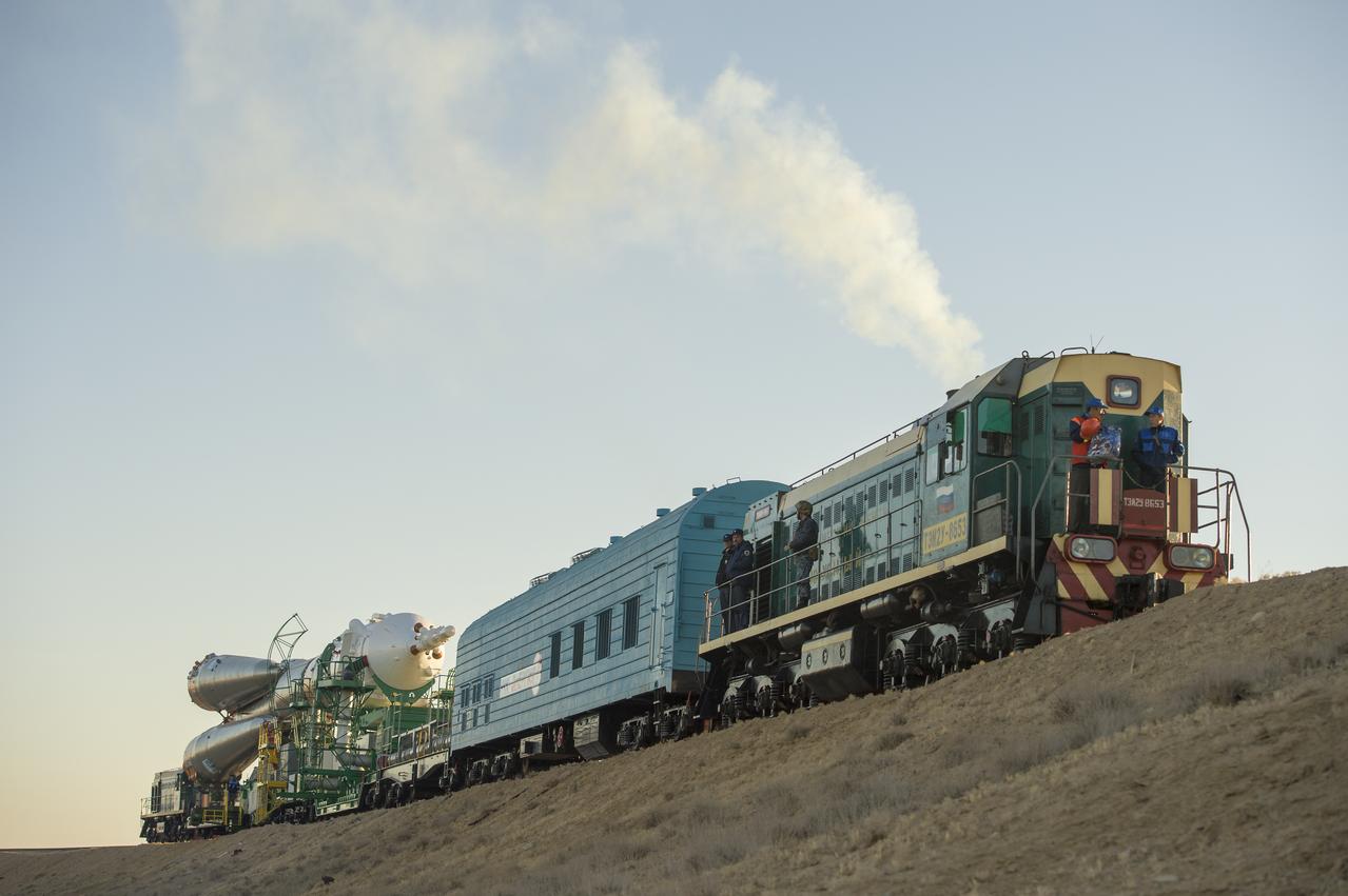 The Soyuz rocket is rolled out to the launch pad by train on Monday, Sept. 23, 2013, at the Baikonur Cosmodrome in Kazakhstan. Launch of the Soyuz rocket is scheduled for September 26 and will send Expedition 37 Soyuz Commander Oleg Kotov, NASA Flight Engineer Michael Hopkins and Russian Flight Engineer Sergei Ryazansky on a five and a half-month mission aboard the International Space Station.  Photo Credit: (NASA/Carla Cioffi)